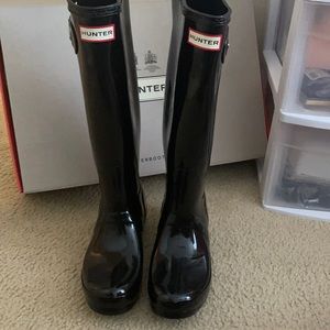 Black tall hunter boots